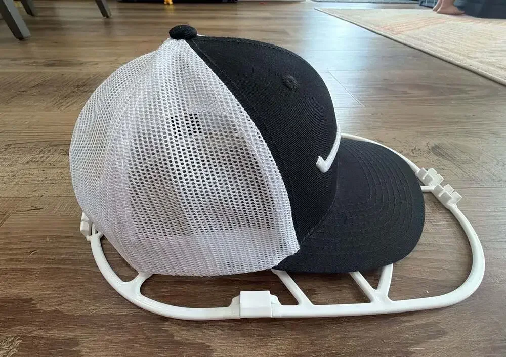 Kimes Ranch Weekly Trucker Cap in Black and White